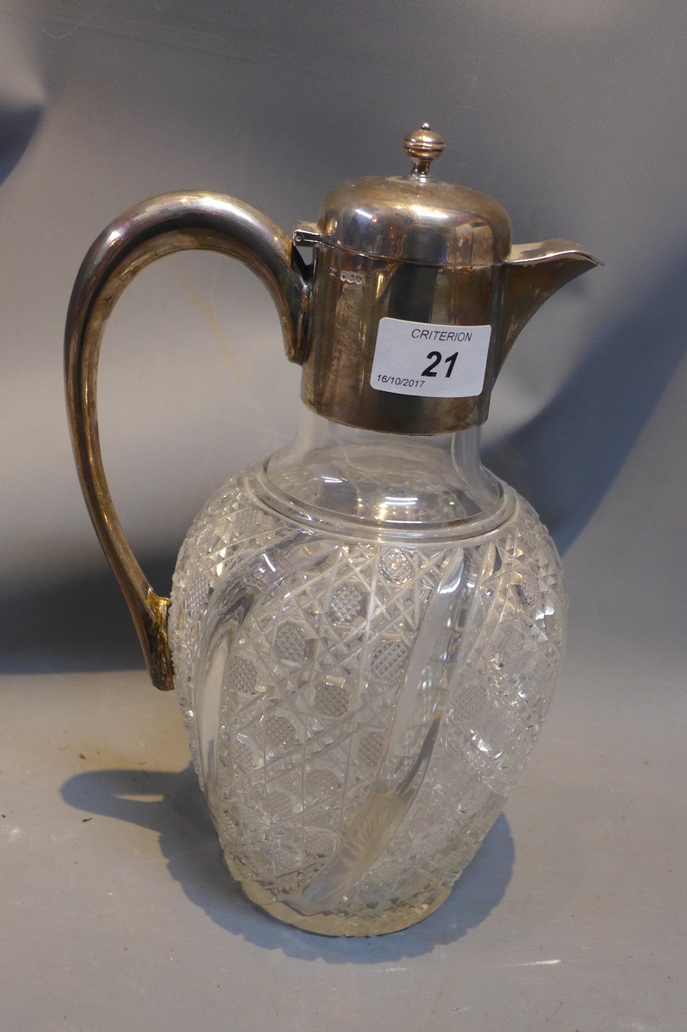 A silver mounted claret jug.