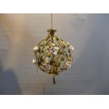 A contemporary wire work chandelier with floral decoration