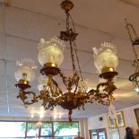 A six branch chandelier having three cherub figures to centre and frosted glass shades.