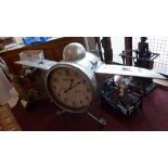 A contemporary aviator style clock in the form of a plane.