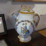 A ceramic teapot, decorated with flowers on a white ground.