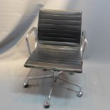 A Eames for Vitra swivel desk chair with black leather chair on chrome supports