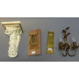 A white painted ceramic wall bracket together with a wall sconce,