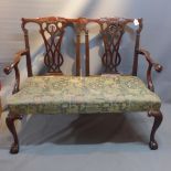 An early 20th Century Chippendale style open hall chair.