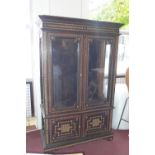 Early 20th century Moroccan bone inlaid cabinet, two glazed doors, fitted shelf interior,