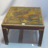 A campaign style mahogany coffee table with glass top depicting a 17th Century map of Europe.