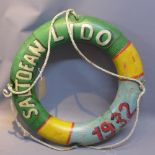 A contemporary wooden model of a rubber ring painted with saltdean lido 1932.