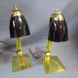 A pair of contemporary brass table lamps.