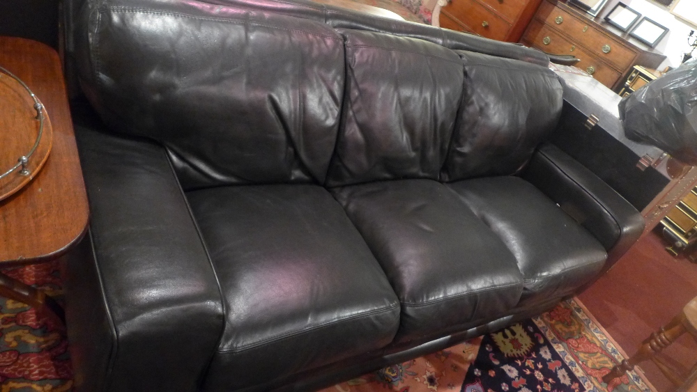 A modern black leather three seater sofa, L. 210cm, D.
