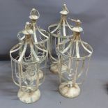 A set of four hanging storm lanterns.