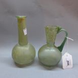 Two pieces of Roman glass to include a vase and jug.