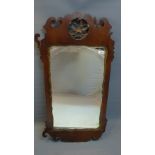 A late 18th/early 19th Century mahogany fretwork mirror, with bevelled plate,