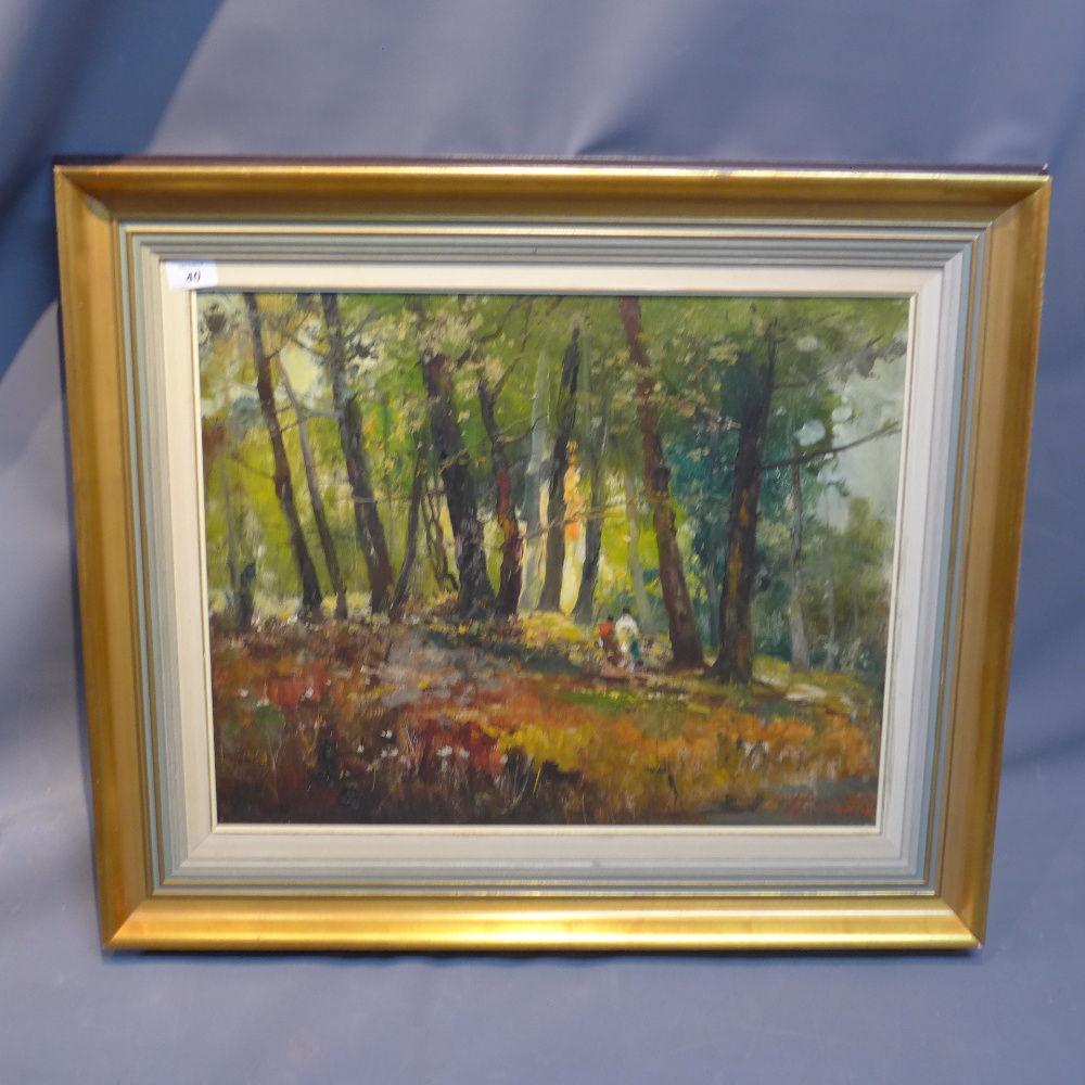 A 20th century oil on canvas, two figures walking through forest glade,