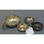 Four French silver wine tasters. Diameter.8cm (largest).