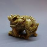 A Japanese ivory netsuke in the form of a dragon, signed. L.3.