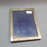 A silver photo frame, maker 'Birks'. H.