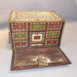 An Indo-Portugese bone inlaid table top chest with drop down flap enclosing an arrangement of