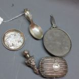 A selection of silver items to include a caddy spoon, perfume bottle,