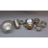 A selection of silver tableware to include napkin rings, bonbon dish, cup,