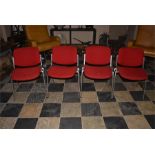 Four Red stacking chairs