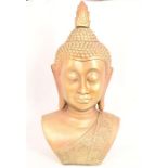 A gold bust of a Buddha