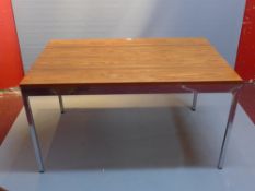 A mid 20th Century low table with rosewood top raised on chrome base, bearing label for Knoll,