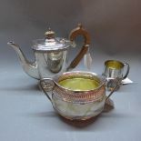 A Sheffield silver plate tea pot together with a sugar bowl and mug