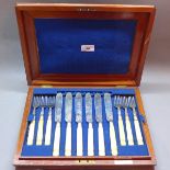 A cased silver plated knives,