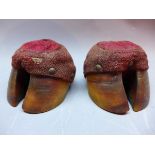A pair of pin cushions in the form of hoofs