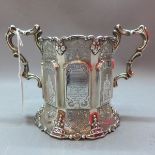 A Victorian silver porringer having engraved panel decorated with figures and holly decoration with