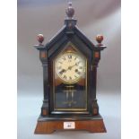 A mahogany and ebonised mantle clock