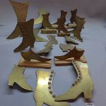 A collection of brass shoe stands