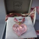 A Lalique pink frosted glass pendant in the from of a heart with yellow metal fitting and in