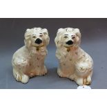 A pair of Royal Doulton dogs,