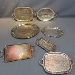 Seven silver plated serving trays.