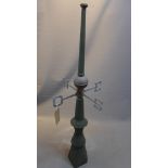 A vintage green painted weathered teak weather vane with brass dial.