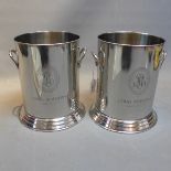A pair of silver plated ice buckets