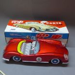 A vintage tin plate sports car in original box