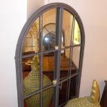 A large arch top garden mirror with gate