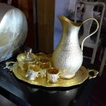 A gold coloured Middle Eastern Takhte-Jamshid tea set