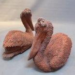 A pair of stone models in the form of pelicans
