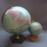 A 20th Century Philips globe together with a small mid 20th Century tin plate globe.