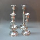 Four sterling silver candlesticks marked 925 (filled)