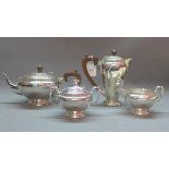 An early 20th Century Birmingham silver tea set comprising of tea pot, hot water pot,