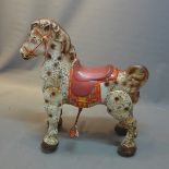 A vintage Mobo Bronco tin plate rocking horse.