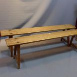 A pair of vintage oak benches.