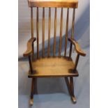 A 19th Century oak stick back rocking chair.