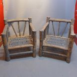 A pair of weathered teak garden chairs.