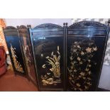 A folding Chinese screen with silk embroided glass covered panels.