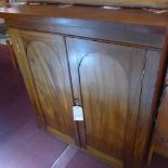 A 19th Century mahogany side cabinet with two doors enclosing shelves and raised on bun feet,